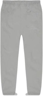 Load image into Gallery viewer, FEAR OF GOD ESSENTIALS Track Pants Silver Reflective
